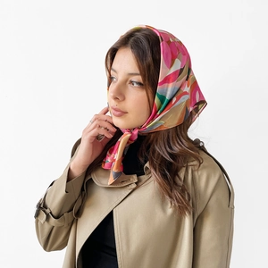 Detailed view of women colorful paisley satin silk scarf tied as a decorative headwrap