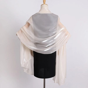 Detailed texture of champagne organza shawl with pearl shimmer on a mannequin