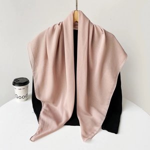Detail of elegant pleated long hijab in dusty rose chiffon fabric for Muslim women