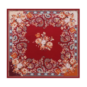 Close-up of red paisley silk scarf with floral center and blue geometric border