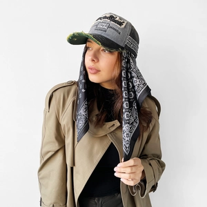 Close-up of vintage denim baseball cap with paisley print silk scarf attached for women