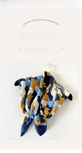 Detail of 90cm twill silk square scarf featuring cloud camo pattern and soft drape
