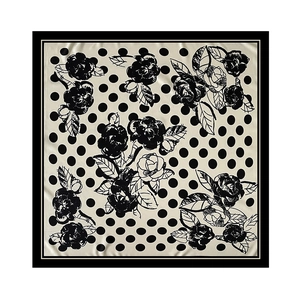 Macro detail of twill square scarf featuring vintage polka dots and camellia pattern