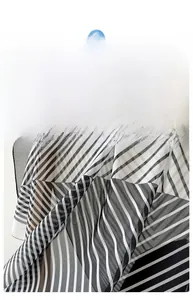 Detail of thin striped square scarf showing semi-transparent fabric and fine texture