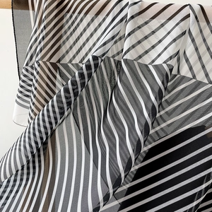 Lightweight black and white geometric pattern silk scarf with modern color-block design