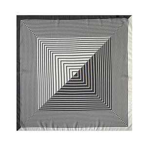 Detailed view of lightweight silk square scarf featuring black and white geometric stripes