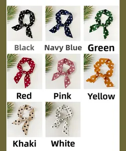 Polka dot skinny scarves shown in eight colors including black, navy, red, and yellow