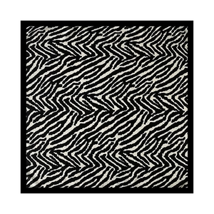 Detailed view of the black and white zebra and chevron pattern on this square silk scarf