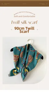 Detail of 90cm twill silk square scarf with luxury chain and tassel print in peacock green