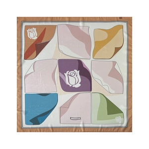 Detail of artistic mosaic pattern on 90cm square silk scarf with floral and geometric motifs