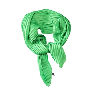 Bright green pleated silk scarf with accordion folds and satin finish in a knotted style
