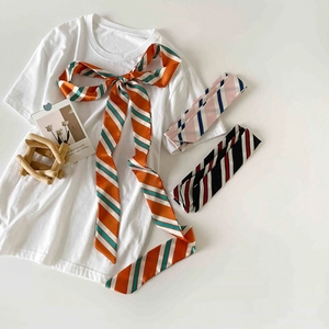 Chic polka dot and striped skinny silk scarf set styled with a white minimalist t-shirt