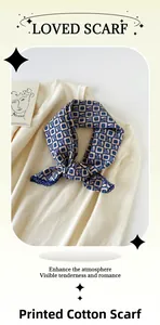 Close-up of cotton neck scarf with navy geometric print and lace edges on knitwear