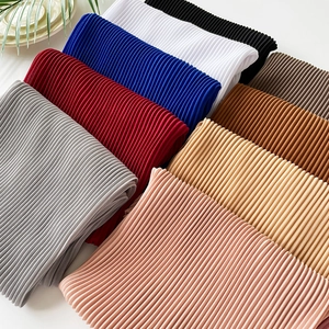 Detailed view of multi-color pleated pearl chiffon scarves in a diagonal arrangement