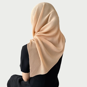 Detailed back view of beige pleated chiffon hijab showing elegant drape and texture