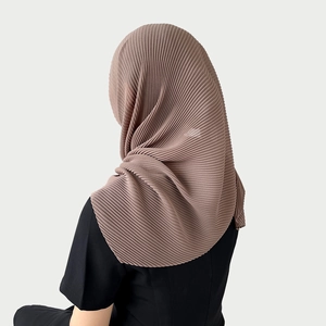 Macro detail of mocha brown chiffon pleated hijab scarf with elegant vertical pleats