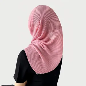 Detail of pink pleated chiffon hijab with fine folds shown on a person from the back
