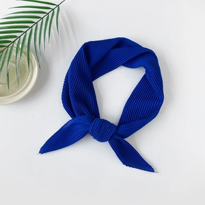 Close-up of pleated dark blue pearl chiffon headscarf with high-density texture detail