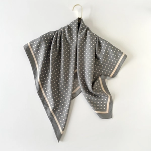 Elegant 90cm grey polka dot twill silk square scarf hanging on a luxury gold hook