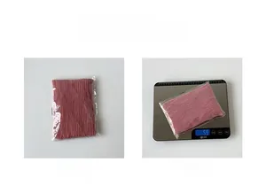 Detail view of pink chiffon pleated square scarf in packaging showing 59g weight