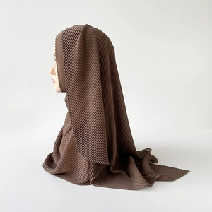 Close-up of fine pleated texture on a dark coffee brown long chiffon hijab for women