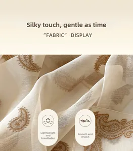 Macro detail of breathable champagne paisley silk scarf showing soft texture and drape