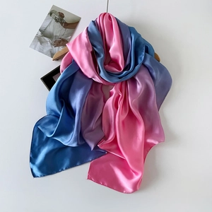 Detail of elegant blue, purple and pink gradient satin scarf with silky luster finish