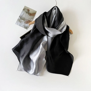 Elegant satin long scarf with black and silver grey gradient color for women on wooden hanger