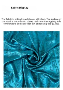 Détail du tissu de foulard en soie paisley bleu sarcelle avec texture douce et lisse
