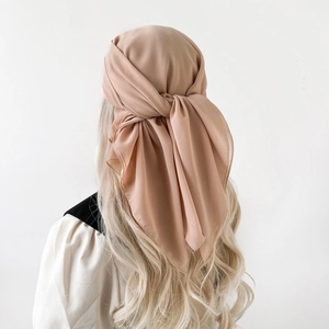 Elegant light coffee chiffon hijab scarf with a secure back-tie knot and soft pleats
