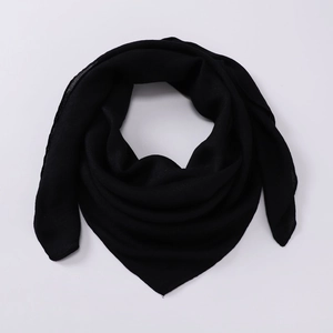 Close-up of the soft black cotton blend fabric texture and drape of the square scarf