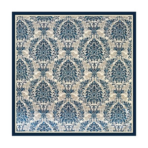 Detail of square silk scarf with navy and beige baroque floral patterns and damask borders