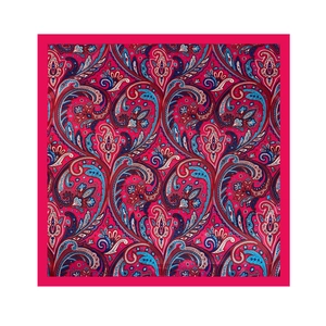 Detailed top view of paisley silk scarf with magenta and royal blue floral patterns
