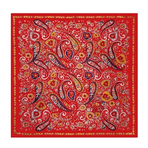 Detailed top view of red satin square scarf with paisley and floral prints on white surface