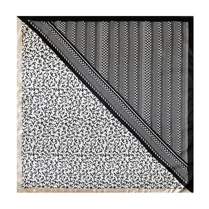 Detail of 90cm satin square scarf showing contrast geometric bird and herringbone patterns