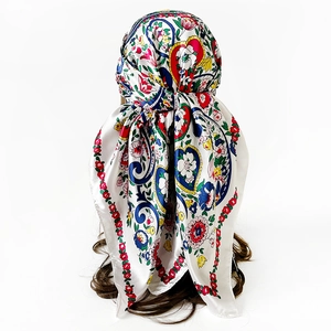 Rear view of a 90cm satin square scarf with colorful paisley and floral patterns