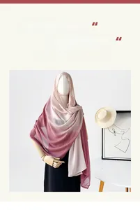 Detail of gradient pink long scarf with breathable fabric texture on a mannequin