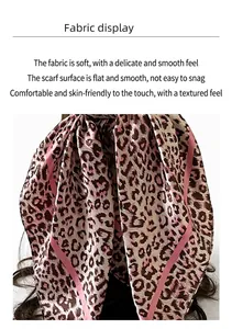 Detailed view of leopard print silk scarf fabric texture with soft satin finish