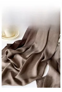 Close-up of brown gradient silk scarf showing breathable fabric and fine stitching