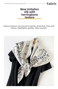 Detailed view of paisley silk-like scarf featuring herringbone texture and monochrome print