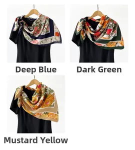 Detailed view of floral scarves in deep blue, dark green, and ginger yellow colors