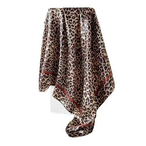 Satin leopard print silk scarf with brown border shown on a minimalist white background
