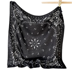 Classic black and white paisley bandana scarf with geometric patterns on white background