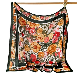 Retro floral print square scarf with warm orange and red tones on white background