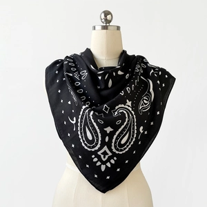 Classic black and white paisley print square headscarf displayed on a mannequin