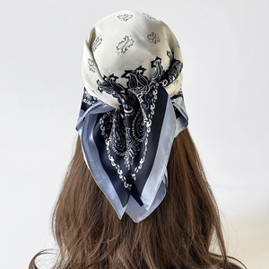 Elegant 70cm silk feel paisley square scarf worn as a decorative head wrap for women