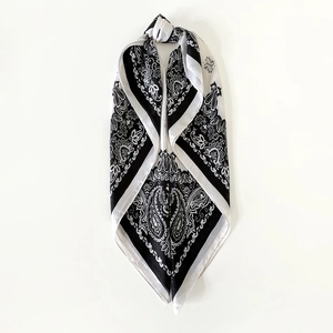 Black and white paisley satin square headscarf for women shown in a V-fold shape