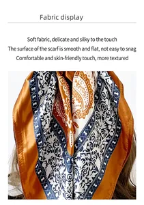 Detailed close-up of paisley pattern silk scarf with premium satin texture and orange finish