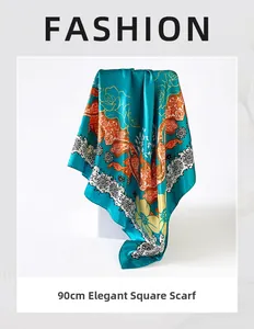 Detail of 90cm square silk scarf featuring blue satin with orange floral print and white lace