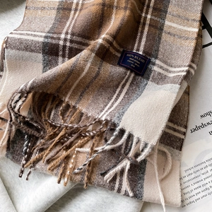 Classic plaid warm scarf in tan tones with fringe edges, high-quality wool blend texture